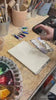 Materiały i farby akwarelowe przygotowane do zajęć z akwareli w Alike Pottery Studio
